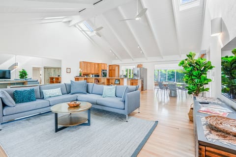 Large, open beam living area with garden views.