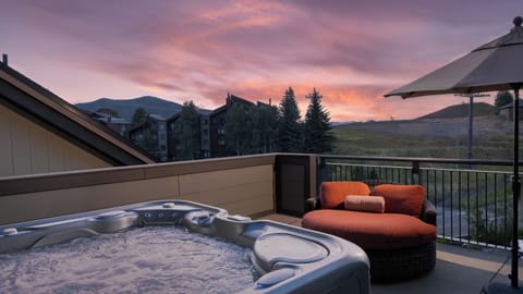 Peek the mountain tops from your private hot tub