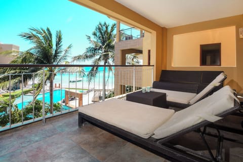Begin your vacation days by sipping coffee or a morning mimosa on our private terrace, featuring comfy loungers!