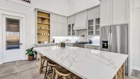 Gather around the spacious island for morning coffee, casual meals, or late-night chats. This beautifully designed kitchen invites you to cook, connect, and create unforgettable moments in a space that feels both luxurious and welcoming.