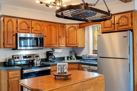 Cozy kitchen equipped with stainless steel appliances, offering a modern and efficient space for preparing meals