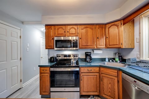 Cozy kitchen equipped with stainless steel appliances, offering a modern and efficient space for preparing meals