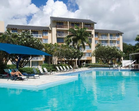 Unwind poolside with gentle breezes and easy lounge seating.
