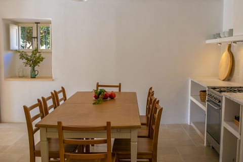 The cool, beamed, ground floor kitchen for relaxed indoor dining for ten