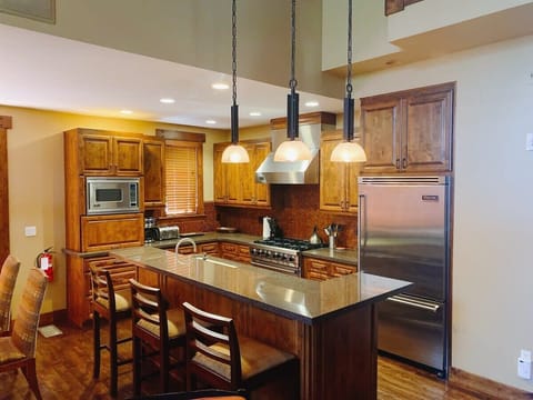 Kitchen: In our kitchen, you'll find brand new appliances, including a stove, refrigerator, and microwave and a coffee station.