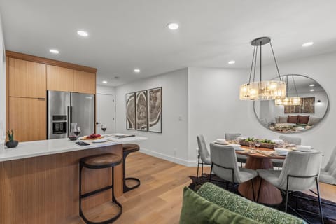 The open concept dining and living area with a breakfast bar with seating for 2.