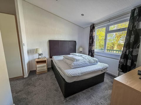 Cozy bedroom retreat with natural light and peaceful views