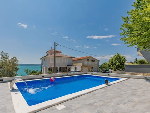 Cloud, Sky, Plant, Water, Building, Swimming Pool, Tree, Shade, Rectangle, Architecture
