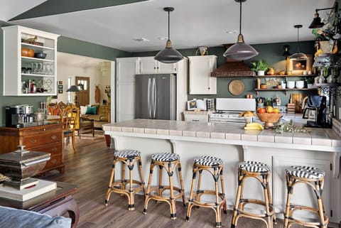 A French styled chef's kitchen with literally everything you can think of to create meals for family and friends.....well, everything but an air fryer.  ;)