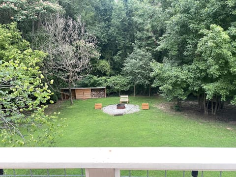 It also overlooks this fire pit, which is only accessible to the downstairs unit