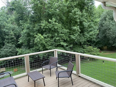 Deck overlooks a large backyard, but is only accessible to the downstairs unit. 