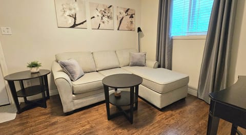 Living Room with coffee table, side table and sofa bed