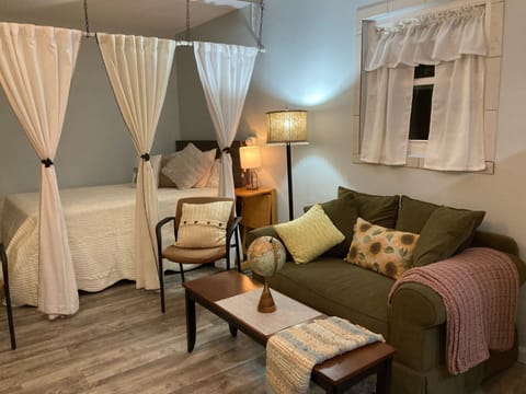 Relax in bed or on the love seat.  The television can be viewed from both.