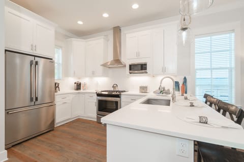 Morning quick breakfast, everyone between the Island & the dining table