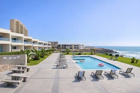 aerial view of outdoor pool, hottub and lounge area