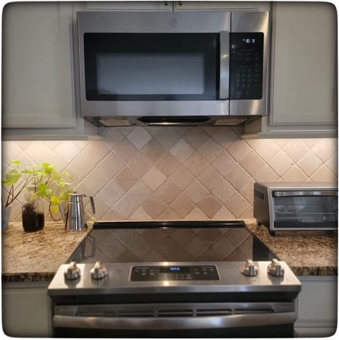 Glass Top Stove and Microwave are the focal point of the large area. 