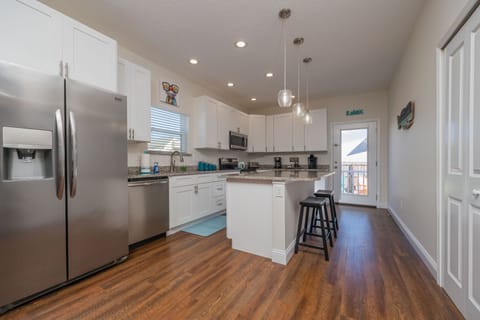 Gather, Cook, Eat, Repeat!  This kitchen is designed well for families!