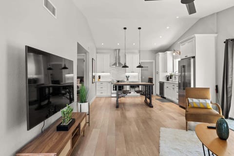 Front room meets the kitchen in this gorgeous, open cottage style home.