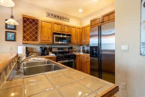 Full size kitchen with stainless steel appliances.