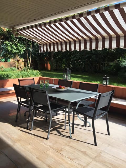Terrace with a dining table suitable for 10 persons.