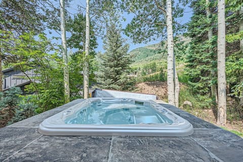 Enjoy a private outdoor hot tub just steps from your front door, complete with a heated walkway. Relax on your private patio while taking in the gentle mountain views—perfect for unwinding after a long day. Experience serenity at its best!