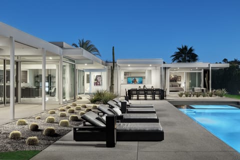 Lounge poolside in impeccable style.  Cushioned lounges adjust to flat recline.