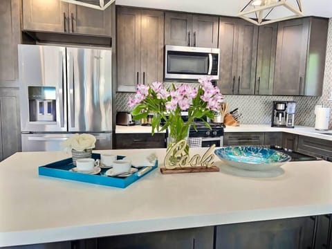 Fully-stocked kitchen with island.