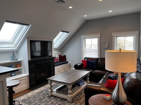 Living room has a fireplace and xfinity flex for all your streaming needs.