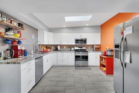 A  massive kitchen, with plenty of space and plenty of amenities to cook with!