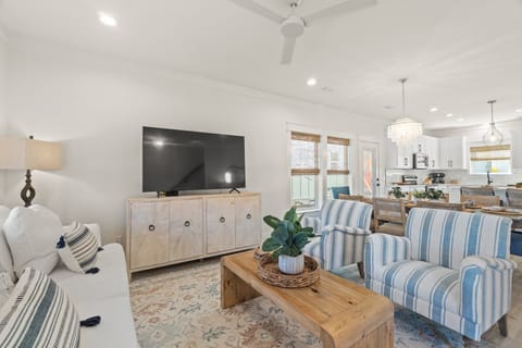 Comfortable seating in the living room for watching movies on the 65 inch TV