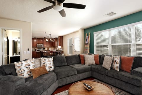 This sumptuous couch is incredibly comfortable! With plenty of room for the whole group to spread out and relax, you’re all set for a family movie night in this luxurious home theater. So grab some snacks and sprawl out; it’s going to be great!