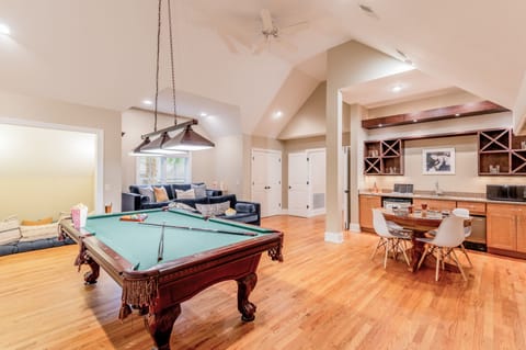Recreation room features billiards, a card table, and a wet bar.