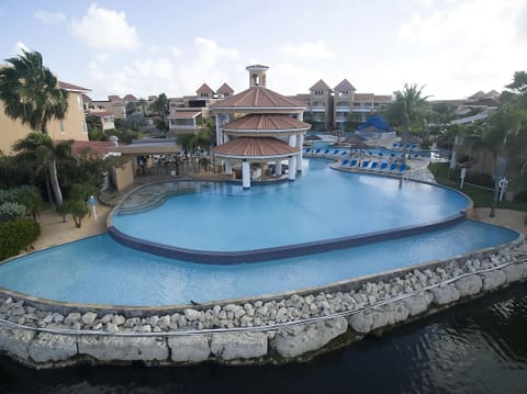 Float beside the infinity edge with panoramic resort views.