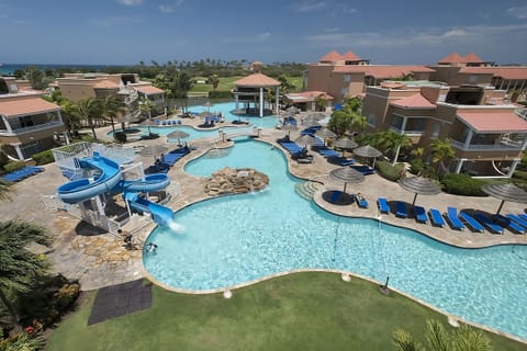 Dive into sparkling lagoon pools with slides and loungers.