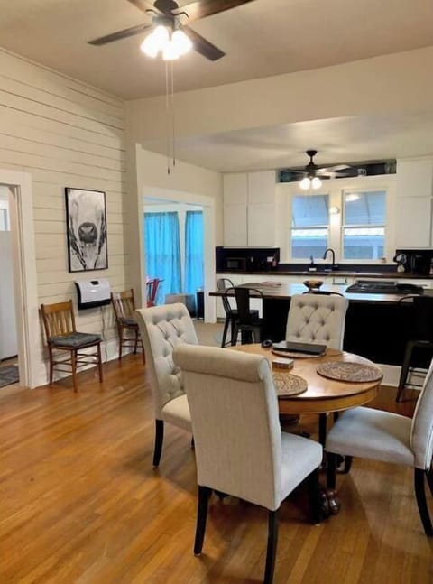 The dining room and kitchen offer open concept and seating for large groups.