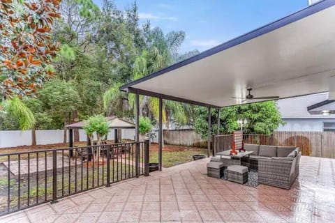 Welcome to the living room with a  lounger sofa that seats the whole group.