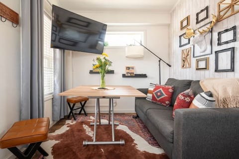 Cozy up in our charming living room, where comfort meets style! Perfect for movie nights or a quiet read.