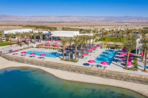 Community pool, workout facilities, and bar.