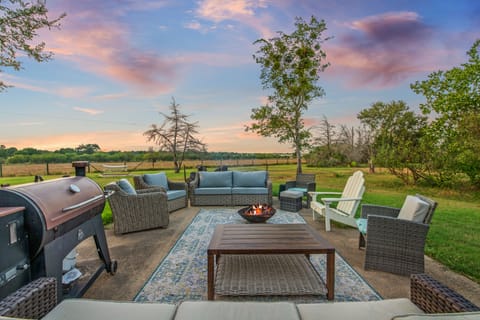 Grill, chill, and enjoy sunset views by the fire pit on the patio.