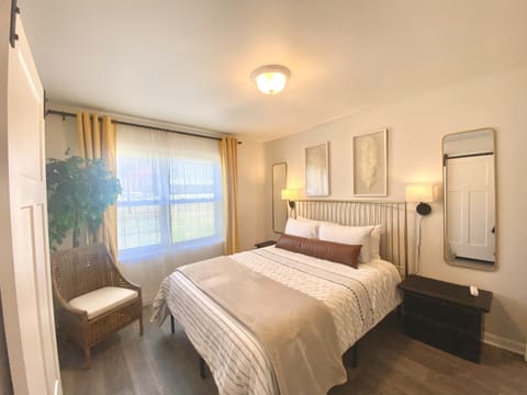 Main floor primary bedroom, adjacent to full size bathroom
