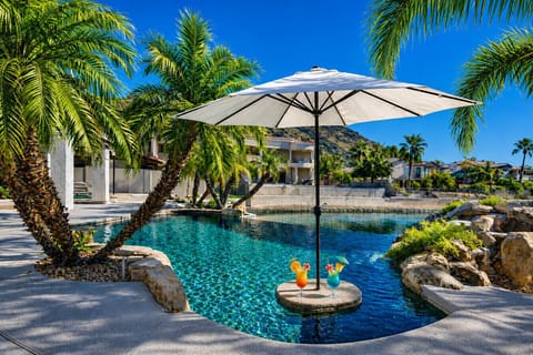 Beautiful waterfront home featuring a boat, private dock, and infinity pool – guest favorite