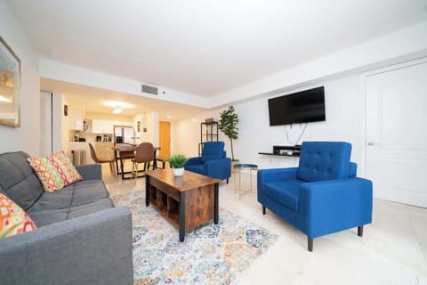 Modern open concept living space featuring a cozy sofa bed