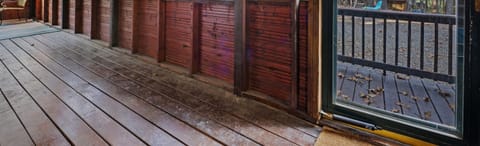 Step out to enjoy the fresh air and beautiful surroundings from this screened-in porch.