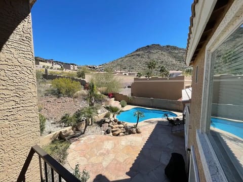 Master Bedroom Balcony View of Pool and Mountain