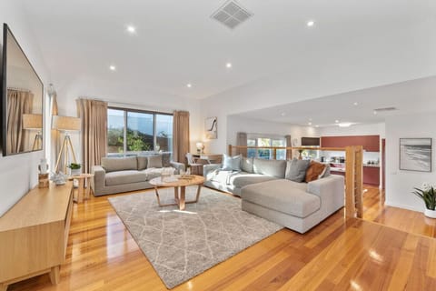 Lounge is on a higher level with 3 Steps down into the lower level of the house.The Lounge room has an enormous 75` Smart HDTV with free Netflix, iView, SBS on Demand, 9Now and 7Plus etc.