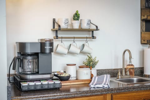 Upper level coffee bar with a combo Keurig & drip coffee, sink, and mini fridge