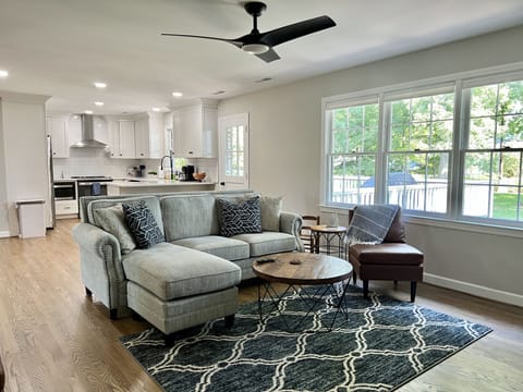 Large open family room with lots of natural light and view of backyard.