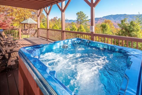 Spacious hot tub with stunning views and access to the 1.6 acres of grounds