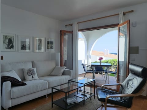 Living room. It opens to the porch and to a small private garden