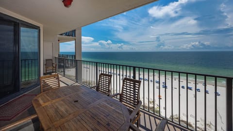 Enjoy meals or drinks at the outdoor table while taking in the expansive beach views and gentle breezes